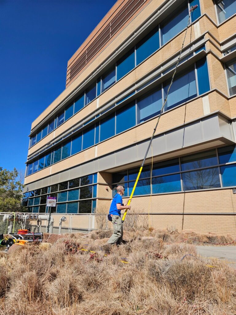 Metropolis crew cleaning Mead storefront